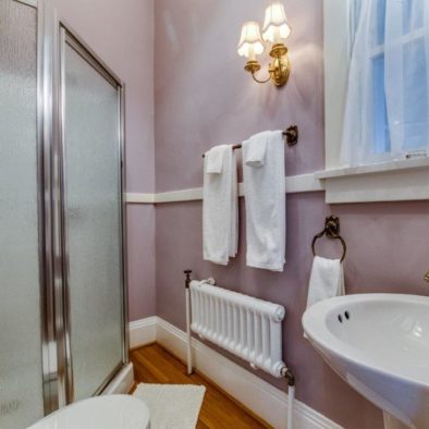 purple room with quilt bathroom